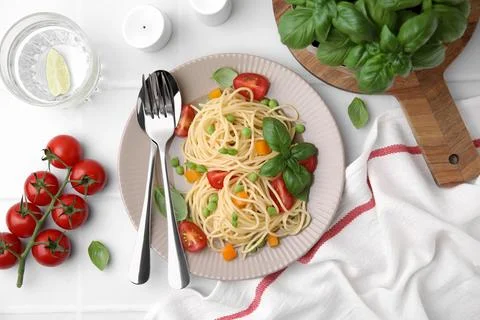 Delicious pasta primavera served on white table, flat lay Stock Photos