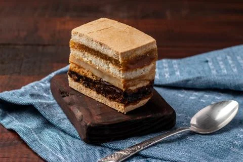 Delicious peruvian dessert called King Kong with dulce de leche and jam. Stock Photos