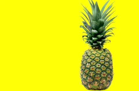 Delicious pineapple on yellow background Stock Photos