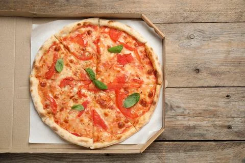 Delicious pizza Margherita on wooden table, top view Stock Photos