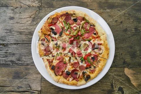 Delicious pizza served on porcelain plate Stock Photos