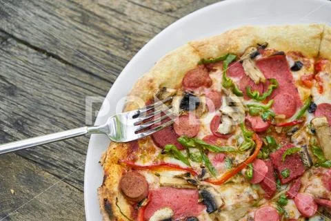 Delicious pizza served on porcelain plate Stock Photos