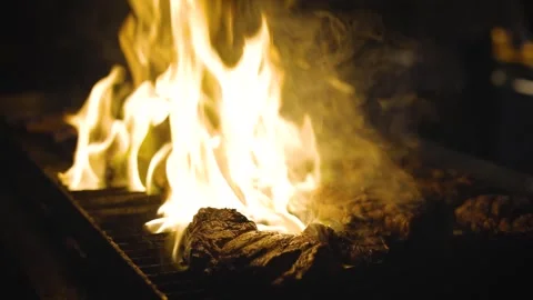 Delicious pork or beef steaks are grilled over a live fire. Classic foods Stockbeeldmateriaal 339144326