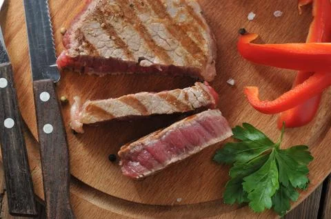 Delicious portion of healthy grilled lean medium rare beef steak Stock Photos