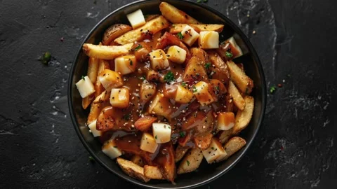 Delicious Poutine with Fries, Cheese Curds, and Gravy Stock Footage 280415445