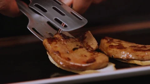 Delicious preparation of the dish puts on the bread meat in restaurant kitchen Stock Footage 100306975