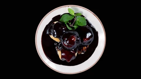 Delicious profiteroles with chocolate Stock Footage 235437661