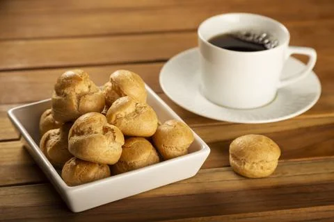 Delicious profiteroles on the table. Stock Photos