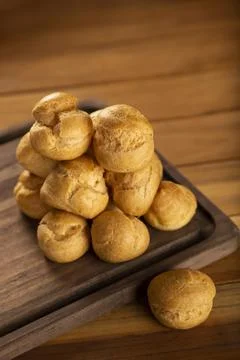 Delicious profiteroles on the table. Stock Photos