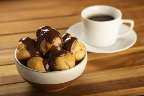 Delicious profiteroles on the table. Stock Photos