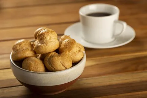 Delicious profiteroles on the table. Stock Photos