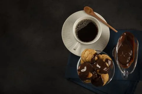 Delicious profiteroles on the table. Stock Photos
