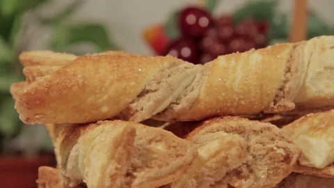 Delicious puff cookie rotate on the background of flowers Stock Footage 69885463