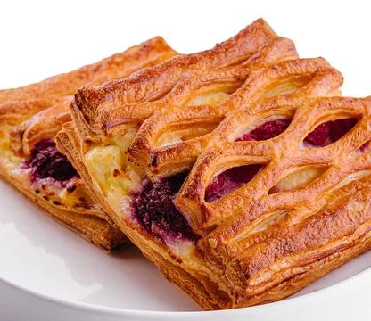 Delicious puff pastry with raspberry jam Stock Photos