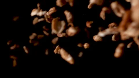 Delicious puffed honey cornflakes falling down on black background Video stock 153588545