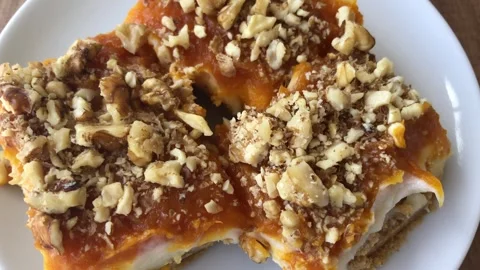 Delicious pumpkin dessert with walnut. Stock-Footage 272635883