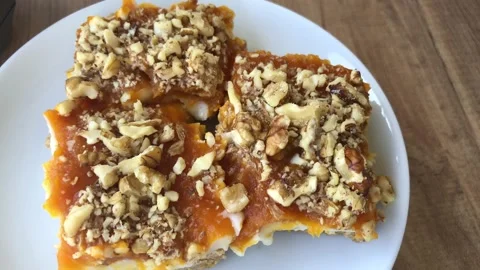 Delicious pumpkin dessert with walnut. Stock-Footage 272639463