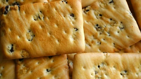 Delicious raisin cracker cookies rotating background Stock Footage 337830688