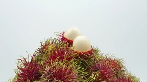 Delicious Rambutans Stacking on White background Rotated. Stockbeeldmateriaal 194891131