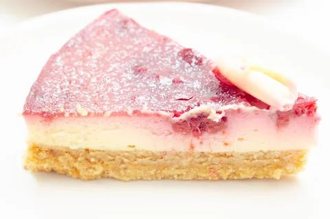 Delicious raspberry cheesecake slice with crunchy crust Stock Photos