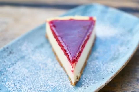 Delicious raspberry cheesecake on the table Stock Photos