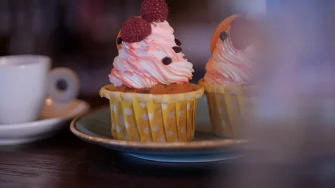 Delicious raspberry cupcakes in a cafe Stock Footage 95171823