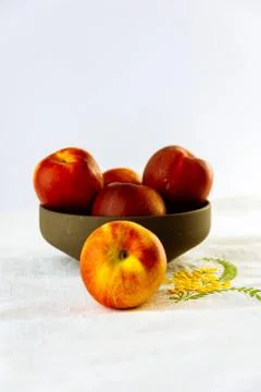  delicious red peaches on rustic table Stock Photos