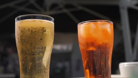 Delicious, Refreshing Beverages Enjoying Beer and Soda Presented in Stylish Stock Footage 288239771