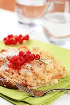 Delicious rice pudding with red berries on plate Stock Photos