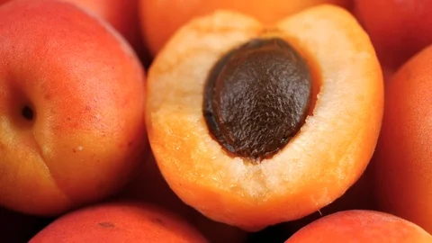 Delicious ripe apricots fruit background, macro tracking shot Stock Footage 112407660
