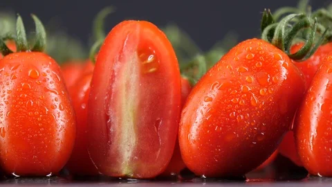 Delicious ripe grape tomatoes, macro close-up tracking shot. Stock Footage 113635666