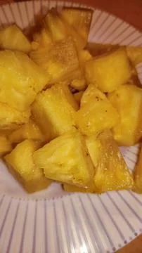 Delicious, ripe pineapple chunks ready to be enjoyed as a snack Stock Photos