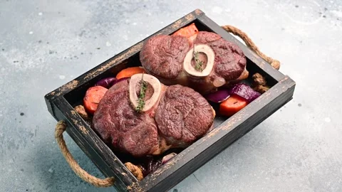 Delicious roasted meat dish served with a variety of colorful vegetables for a Stock Footage 305229482