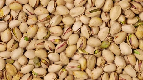 Delicious roasted pistachios in shells background Stock-Footage 320954583