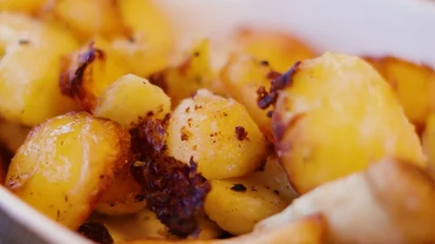 Delicious Roasted Potatoes and Parnsips Root Vegetables in Serving Bowl Ready Stock Footage 295993533