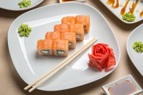 Delicious rolls with salmon on the table Stock Photos