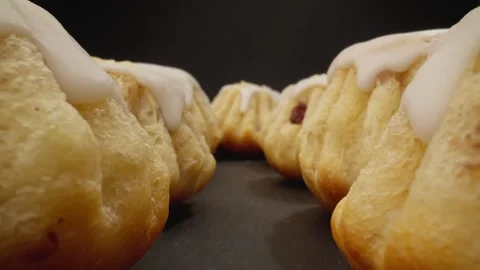 Delicious Rum Cake. Camera moving through row of fresh rum babas. Video stock 243527471