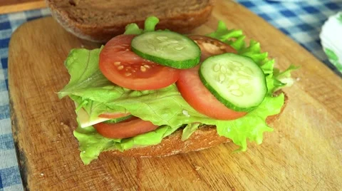 Delicious Sandwich of Rye Bread on a table. 4K Stock Footage 49914053