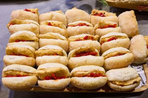 Delicious sandwich tray with breaded cod and red peppers 스톡 사진