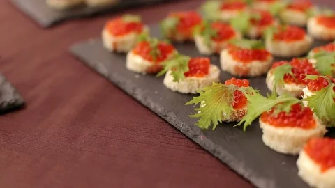 Delicious sandwiches with red caviar, close-up. Stock Footage