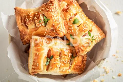 Delicious sausage in puff pastry as a snack for breakfast Stock Photos