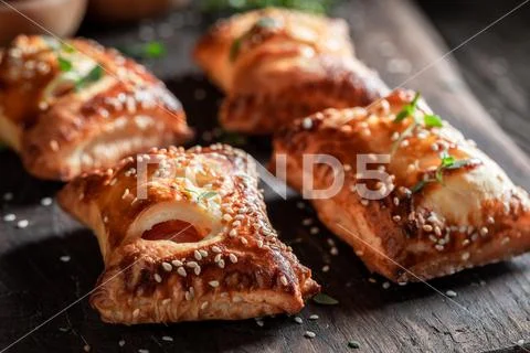 Delicious sausage in puff pastry with tatar sauce and herbs Stock Photos