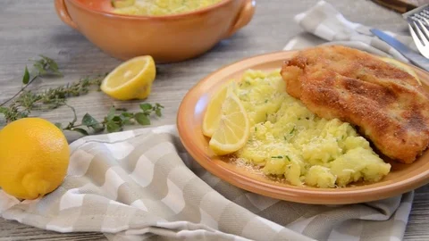 Delicious schnitzel with mashed potatoes with parmesan cheese Stock Footage 73574220