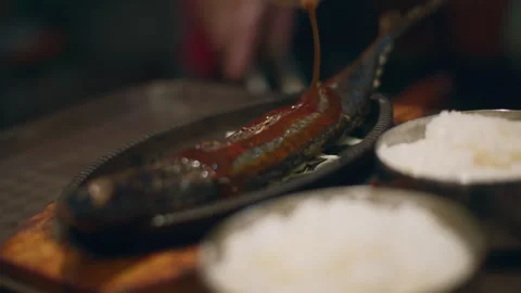Delicious sengseon gui grilled fish close up in Korean street restaurant Stock Footage 343668798