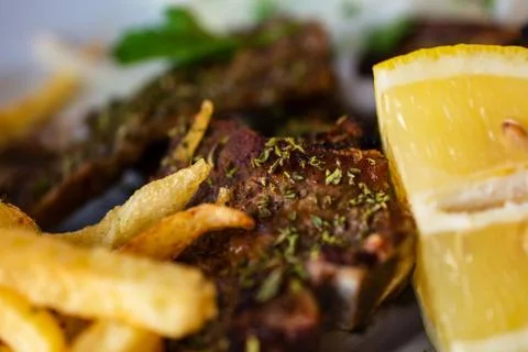Delicious Serving Of Grilled Large T-Bone Steak Seasoned With Herbs By French Foto stock