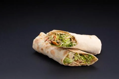 The Delicious shawarma on a black background Stock Photos