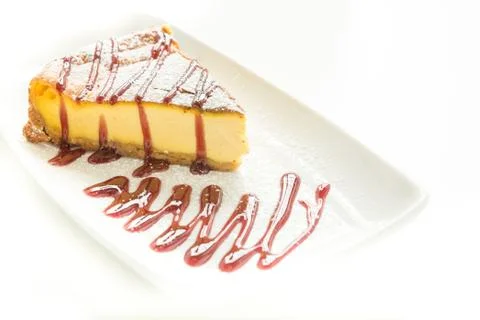 Delicious slice of cheesecake with topping Stock Photos