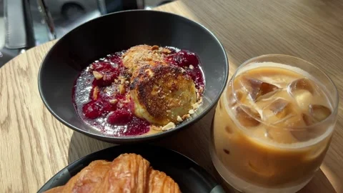 Delicious Slice of Cherry Cheesecake on Black Plate Stock Footage 293024227