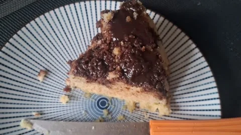 Delicious slice of chocolate crumb cake motion video clip footage Stock Footage 339248264