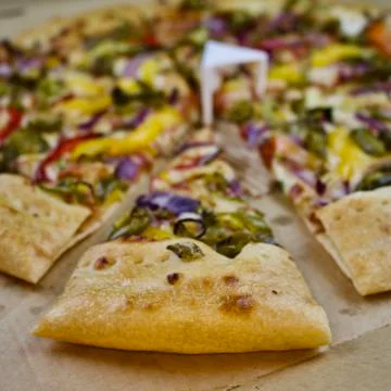Delicious slice of pizza Stock Photos
